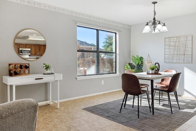 dining room featuring light tile patterned floors and a notable chandelier