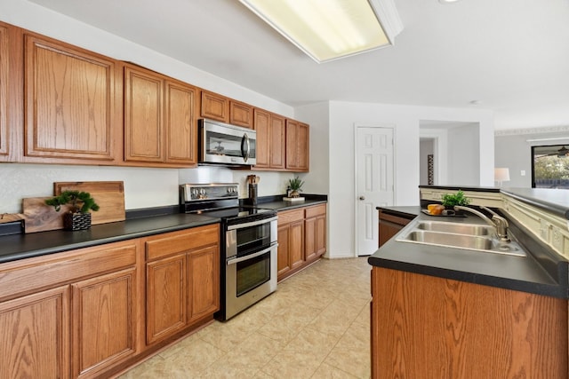 kitchen featuring a kitchen island, sink, and appliances with stainless steel finishes