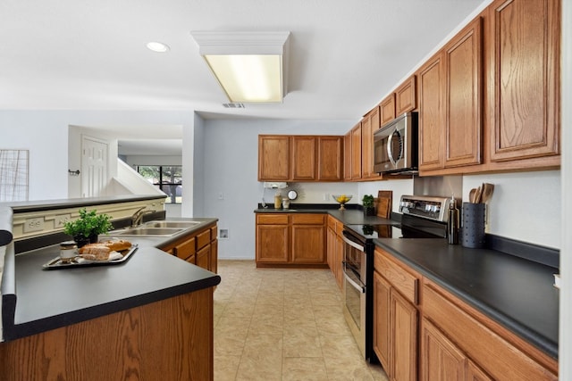 kitchen featuring stainless steel appliances and sink