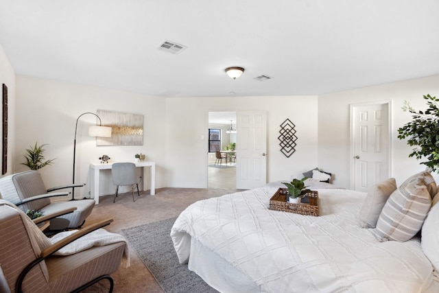 bedroom featuring light carpet