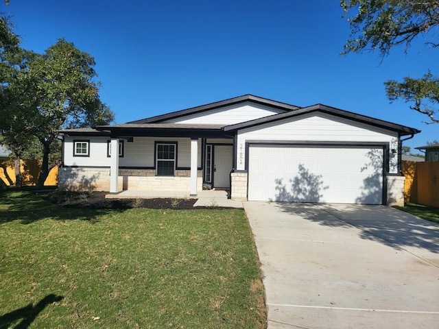 ranch-style house with a garage and a front lawn