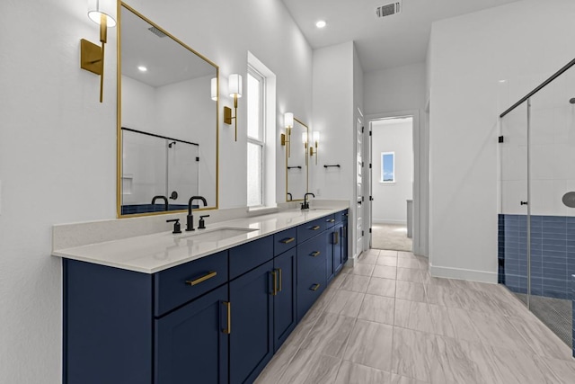 5900 Comanche Moon Trl, Austin, TX 78747 - bathroom featuring double vanity and a stall shower