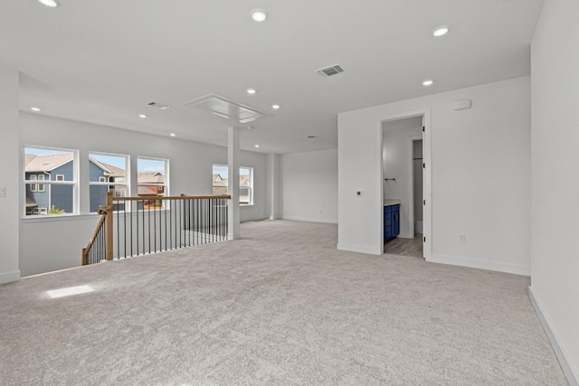 5900 Comanche Moon Trl, Austin, TX 78747 - carpeted spare room featuring attic access, baseboards, and recessed lighting