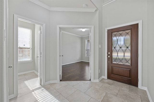 entrance foyer featuring light wood-type flooring and crown molding