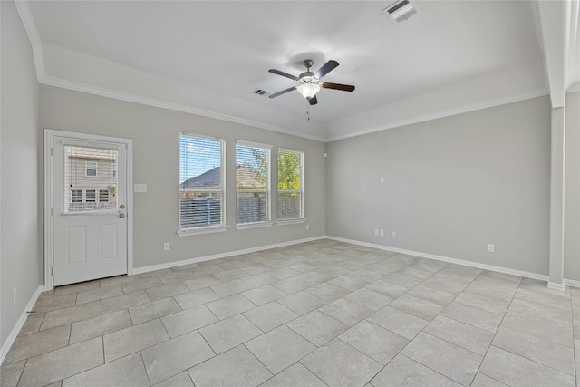 tiled empty room with ceiling fan and ornamental molding