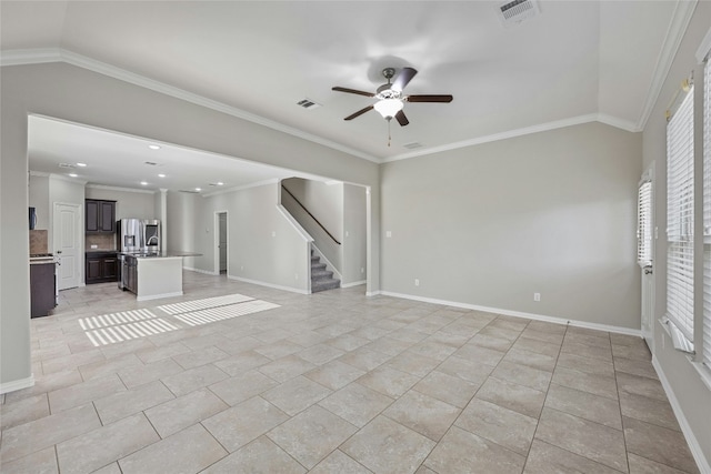 unfurnished living room with light tile patterned floors, lofted ceiling, ceiling fan, and crown molding