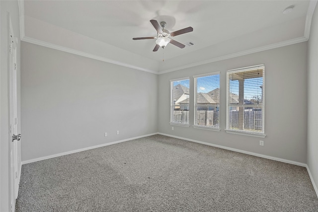 empty room with ceiling fan, carpet floors, and ornamental molding