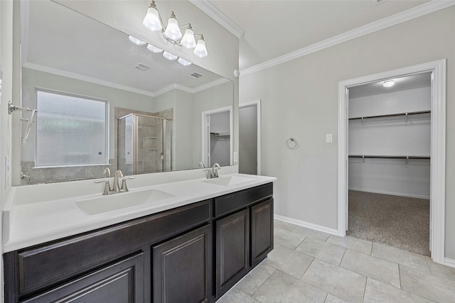 bathroom featuring tile patterned flooring, vanity, walk in shower, and crown molding