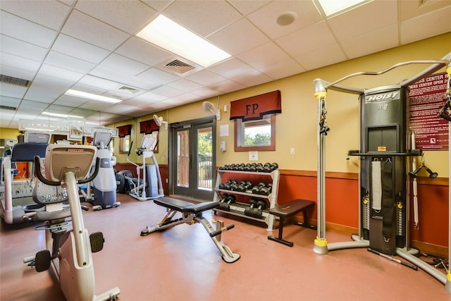 workout area with a drop ceiling