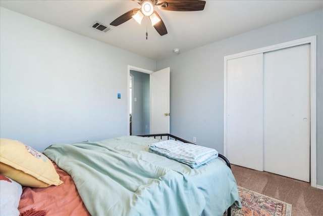 bedroom with light carpet, a closet, and ceiling fan