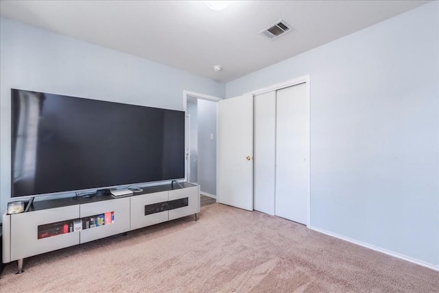 unfurnished living room with light colored carpet