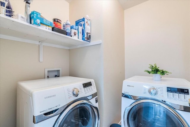 washroom featuring washer and dryer