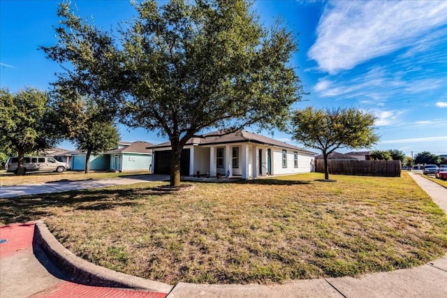 ranch-style house with a garage and a front lawn