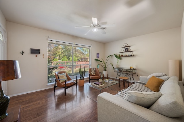 living room featuring ceiling fan and dark hardwood / wood-style floors