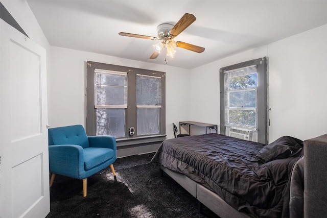 bedroom with carpet, ceiling fan, and cooling unit