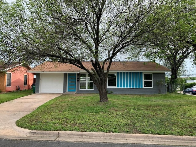 single story home with a front yard and a garage