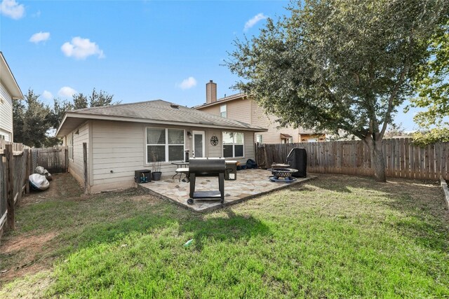 3204 Barksdale Dr, Austin, TX 78725 - rear view of property featuring a patio area, a chimney, and roof with shingles