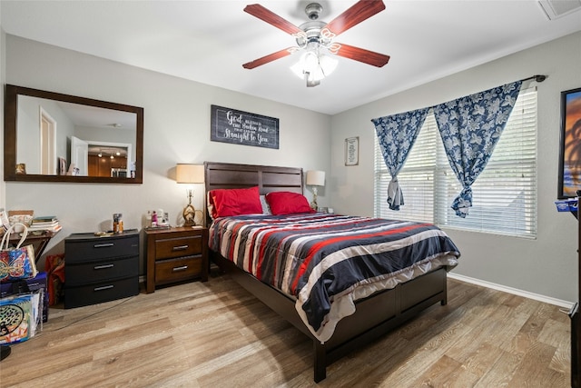 bedroom with ceiling fan and light hardwood / wood-style flooring