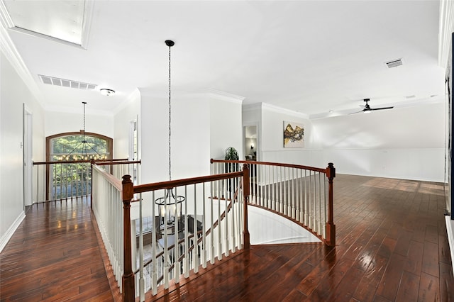 hallway featuring an upstairs landing, a notable chandelier, visible vents, and wood-type flooring