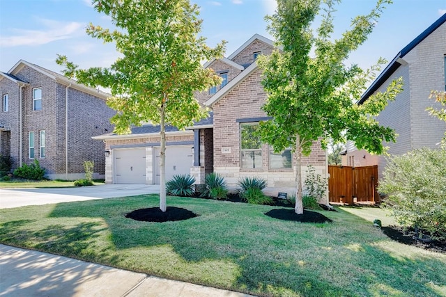 view of front of home with a front lawn and a garage