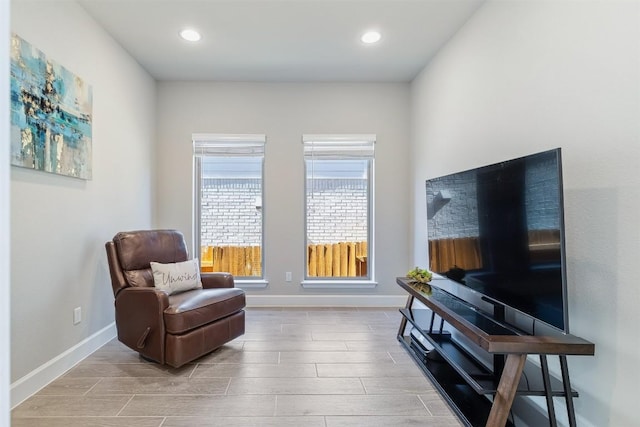 sitting room with hardwood / wood-style flooring