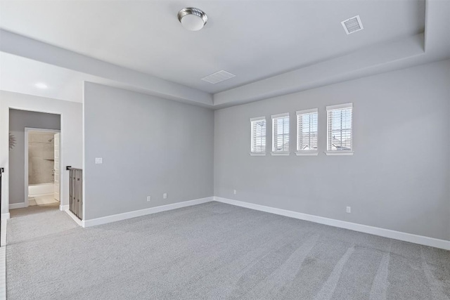 unfurnished room with light colored carpet