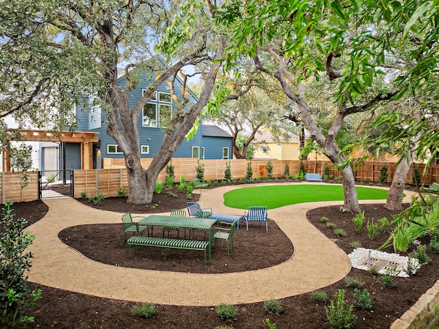 view of property's community featuring a yard