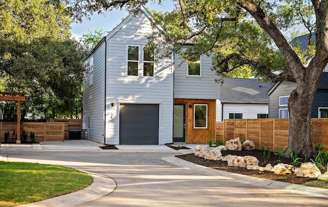 5107 Menchaca Rd Unit 4, Austin, TX 78745 - view of front of property with cooling unit, a garage, and driveway