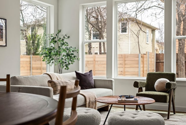 sunroom / solarium featuring healthy amount of natural light