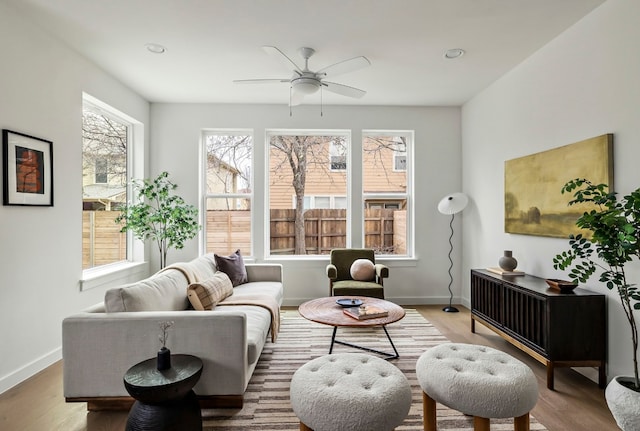 sitting room featuring baseboards, a ceiling fan, wood finished floors, and recessed lighting