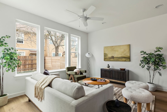 living room featuring plenty of natural light and light wood-type flooring