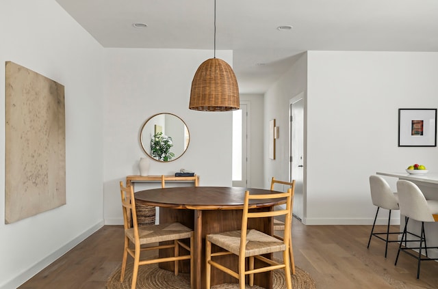 dining room with dark wood-type flooring