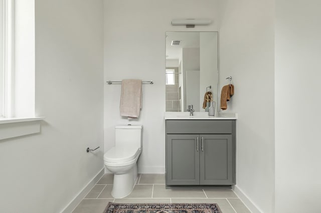 5107 Menchaca Rd Unit 4, Austin, TX 78745 - bathroom with vanity, tile patterned floors, baseboards, and toilet
