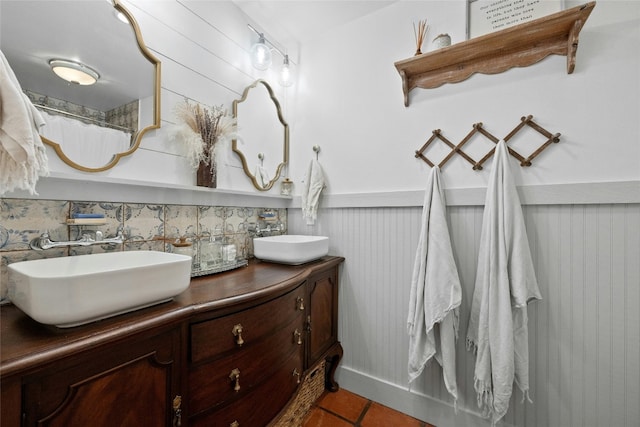 bathroom with tile patterned floors, vanity, a shower with curtain, and wooden walls