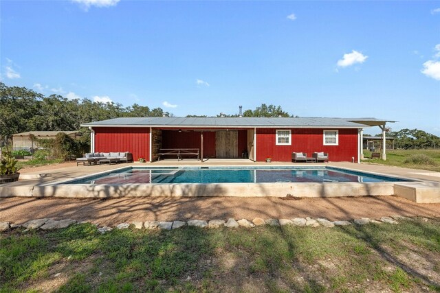 view of swimming pool featuring an outdoor hangout area and a patio