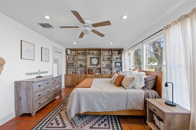 bedroom with tile patterned floors and ceiling fan