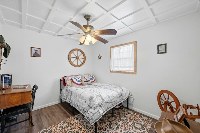 bedroom featuring dark hardwood / wood-style flooring, ceiling fan, and coffered ceiling