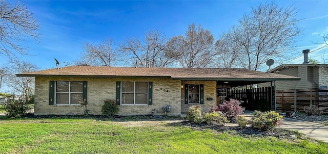 ranch-style home with a front lawn and a carport