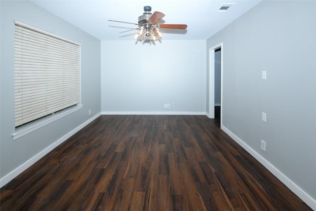 empty room featuring ceiling fan and dark hardwood / wood-style flooring