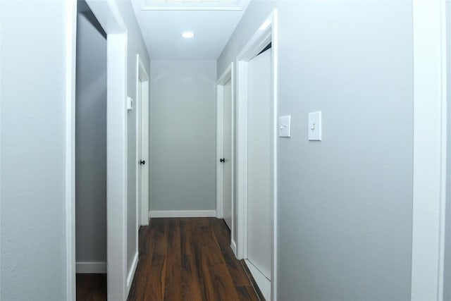 hall with dark wood-type flooring