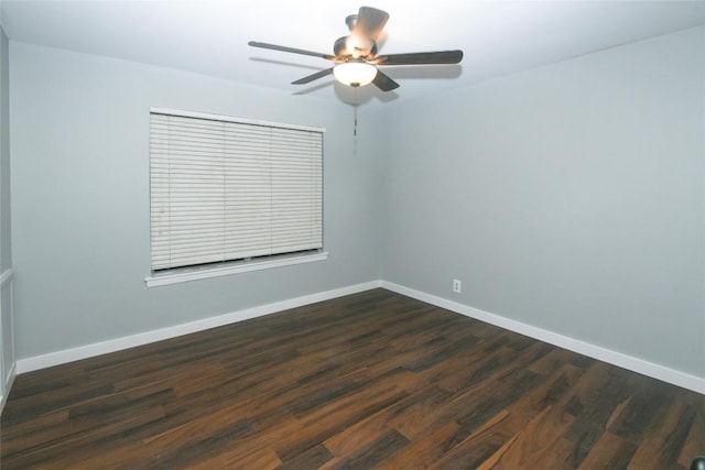 spare room with ceiling fan and dark hardwood / wood-style flooring