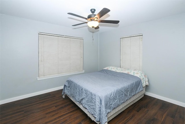 bedroom with ceiling fan and dark hardwood / wood-style floors