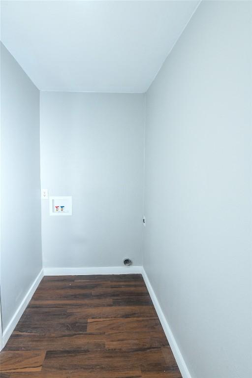 laundry room with dark wood-type flooring and washer hookup