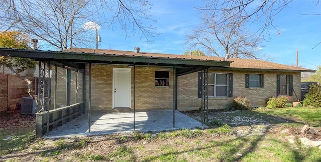 rear view of property featuring a patio area