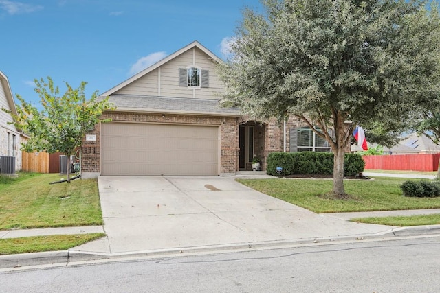 view of front of home with a garage, central AC, and a front lawn