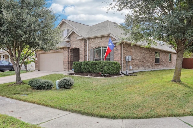 view of front of home with a front yard and a garage