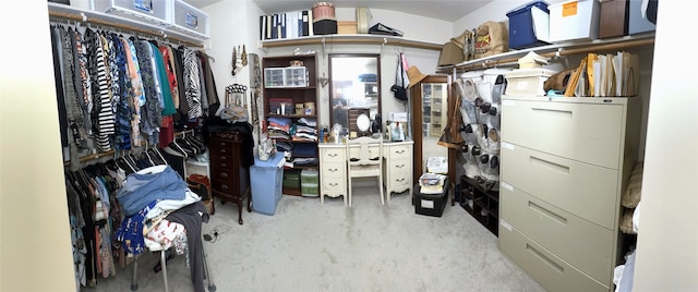 walk in closet featuring carpet floors