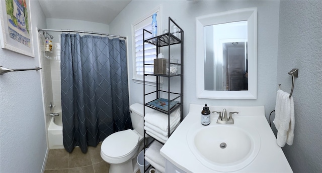 full bathroom with tile patterned flooring, vanity, shower / bath combo, and toilet