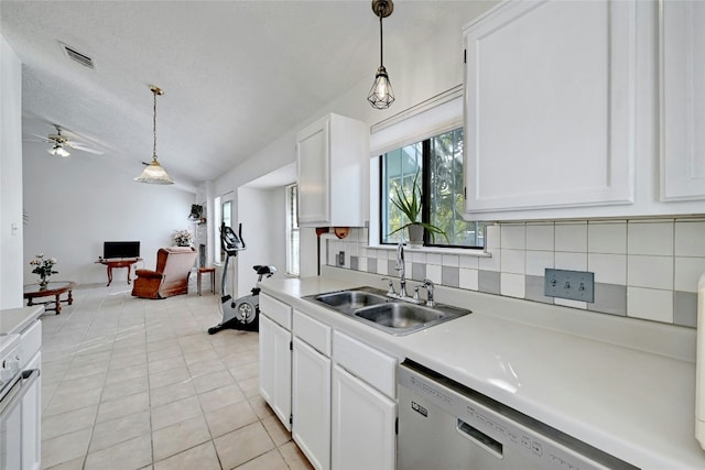 kitchen with white cabinetry, dishwasher, sink, backsplash, and light tile patterned floors