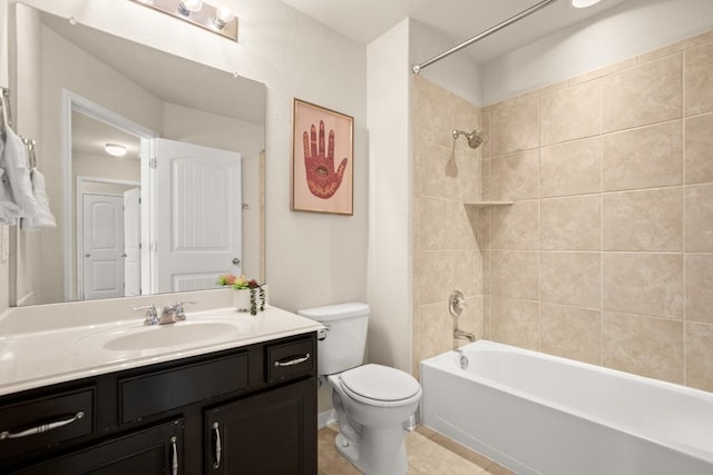 full bathroom with tile patterned flooring, vanity, toilet, and tiled shower / bath